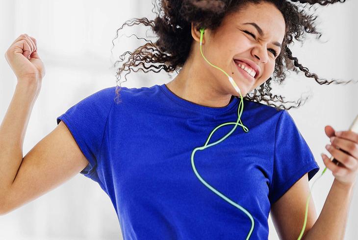 woman dancing with headphones